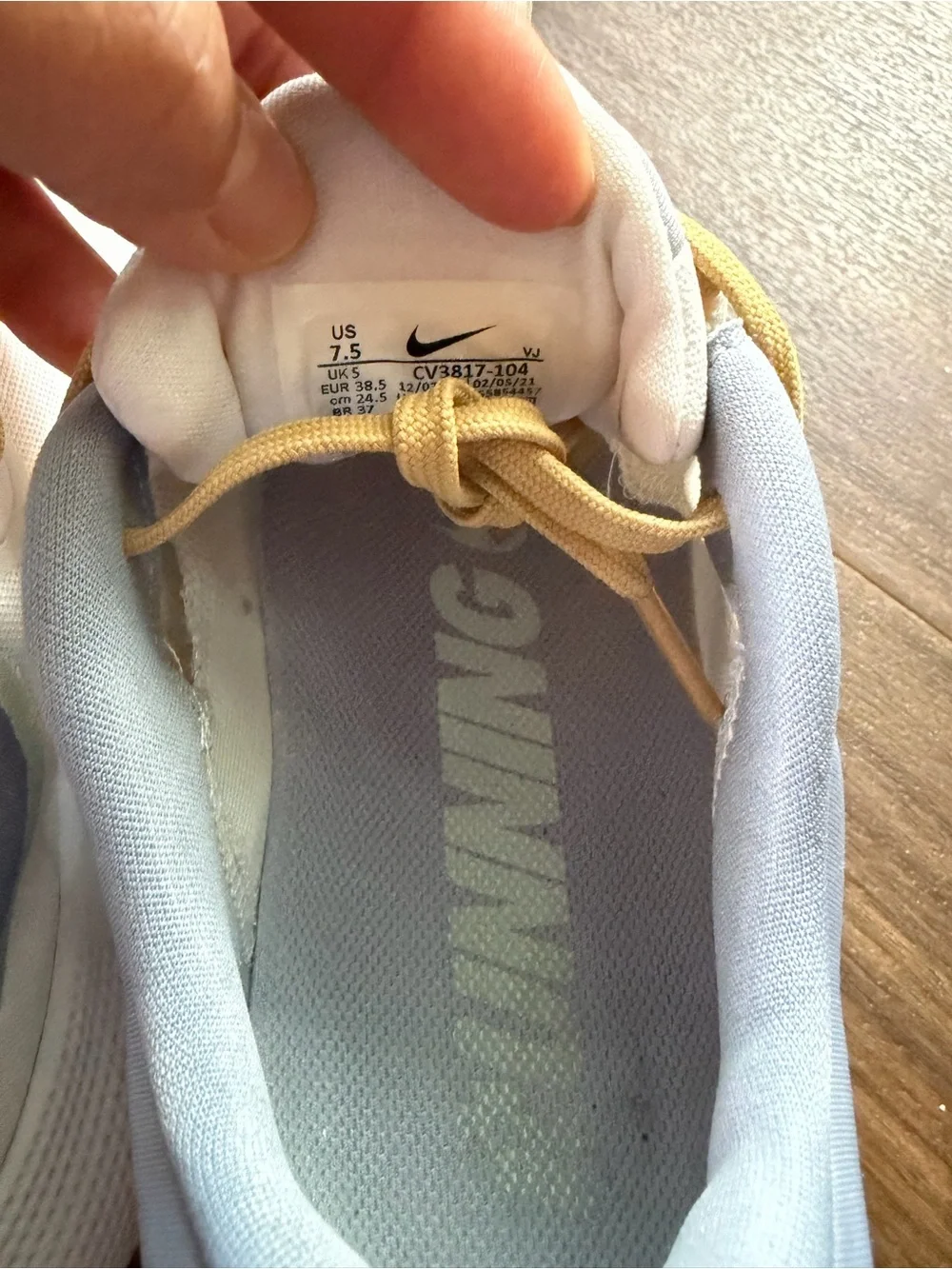 Nike Kids White Sneakers with Pale Yellow Accents